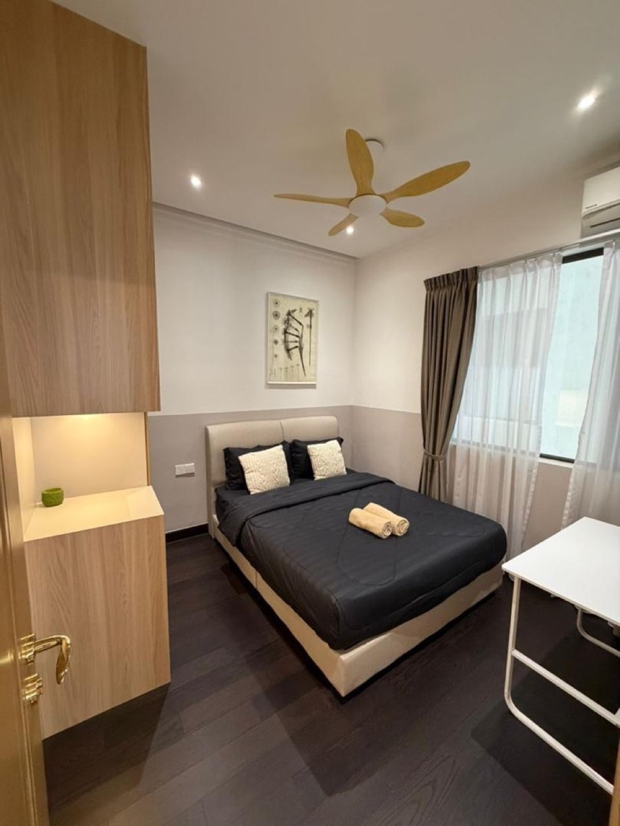 Bedroom with queen bed, wardrobe and ceiling fan at R&F Phase 2, Johor Bahru
